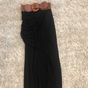 Long black slit skirt with belt.
